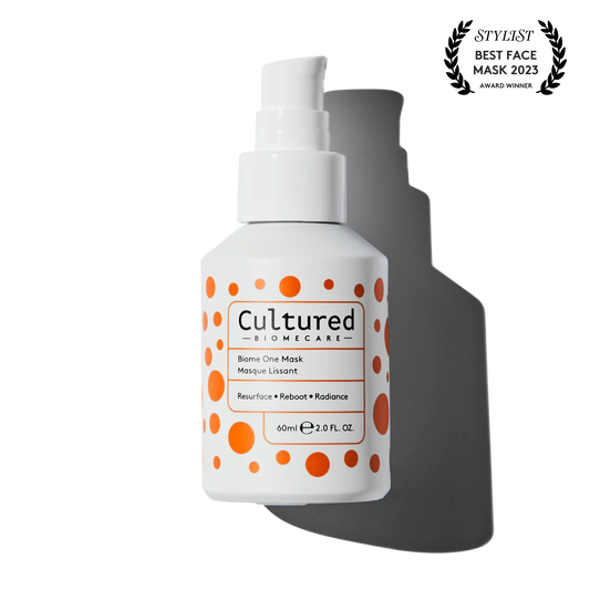 a close up bottle of Cultured Biome One Mask with a Women's Health 'Best Face Mask' award logo in the top right