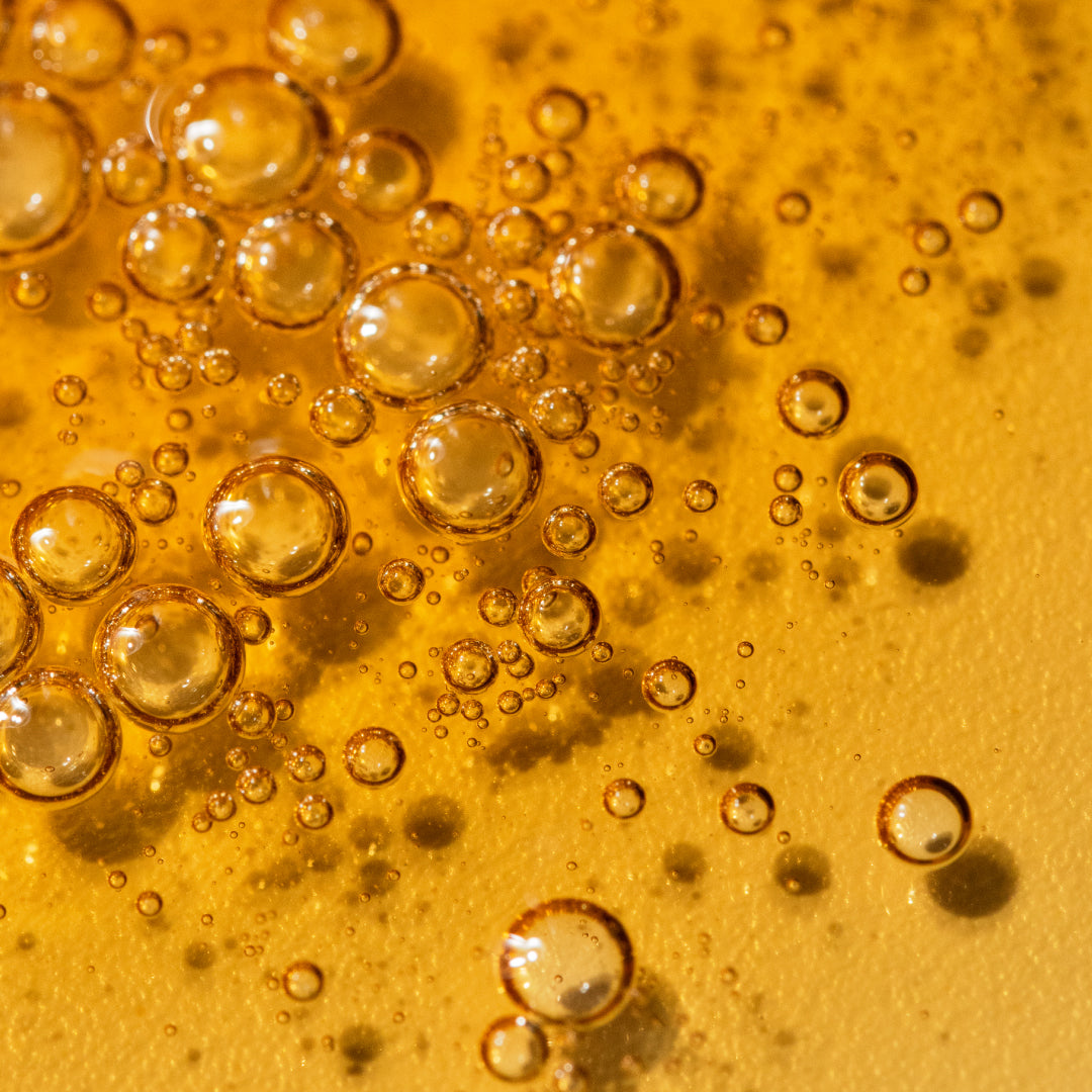 Translucent orange liquid with bubbles.