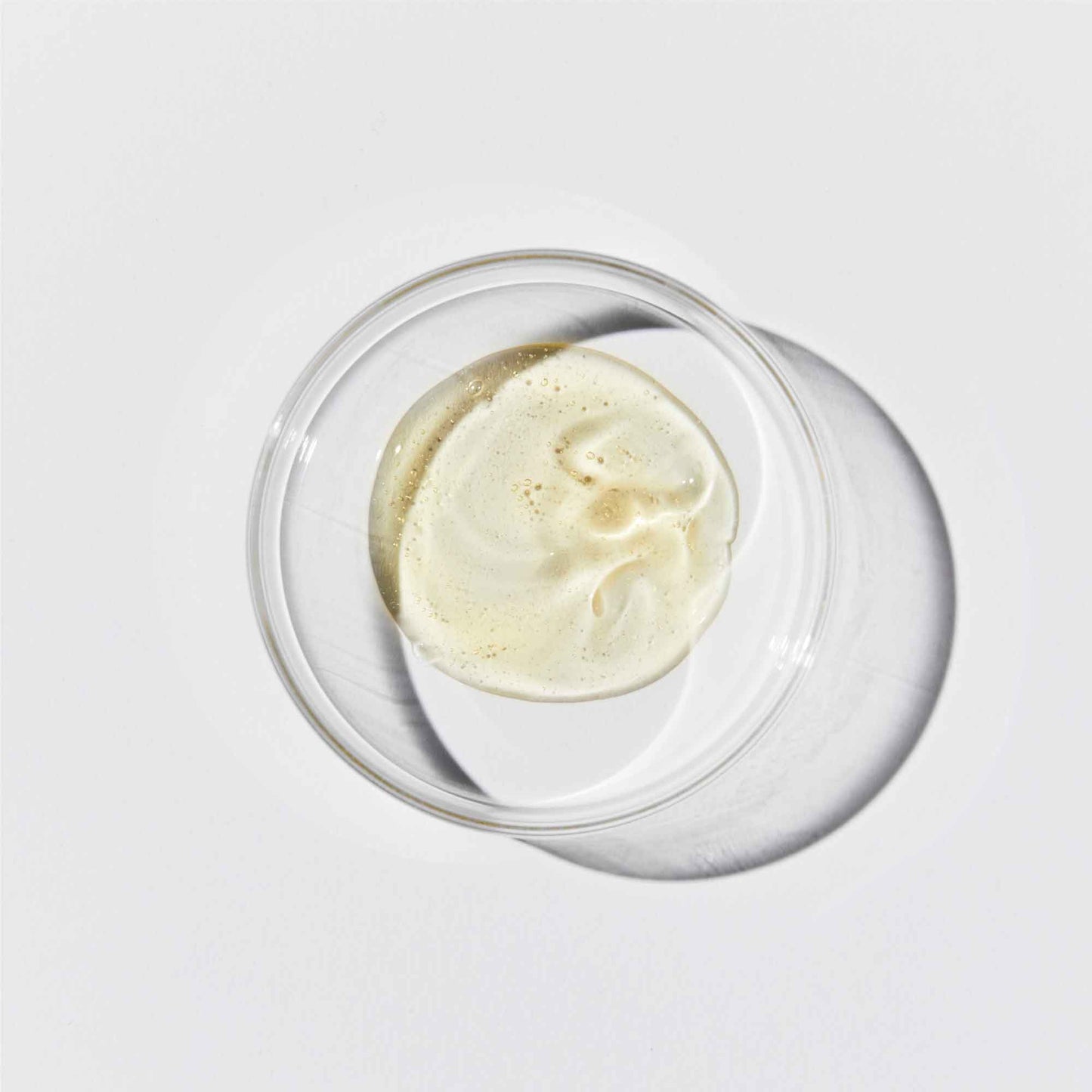 Cleansing balm in a petri dish